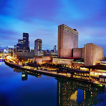 Night view of RIHGA Royal Hotel Osaka along the river in the Nakanoshima district