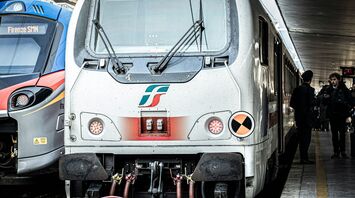RFI train at an Italian station alongside another regional train