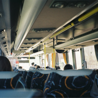 Passengers seated inside a bus