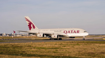 Qatar Airways aircraft taxiing on runway