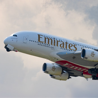 Emirates Airbus A380 in flight, showcasing the airline's branding