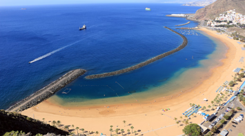 Aerial view of Tenerife Beach with a vast sandy shore and calm waters