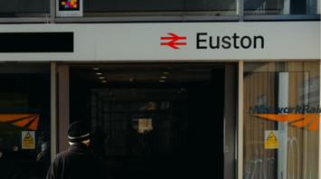 A person walking into London Euston Station entrance