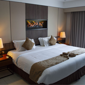 Elegant hotel room with large bed and modern decor