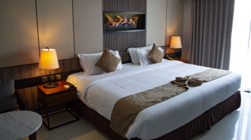 Elegant hotel room with large bed and modern decor