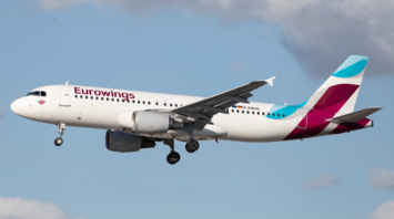 Eurowings aircraft approaching landing with extended landing gear