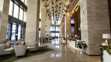 Spacious hotel lobby with modern lighting and seating area