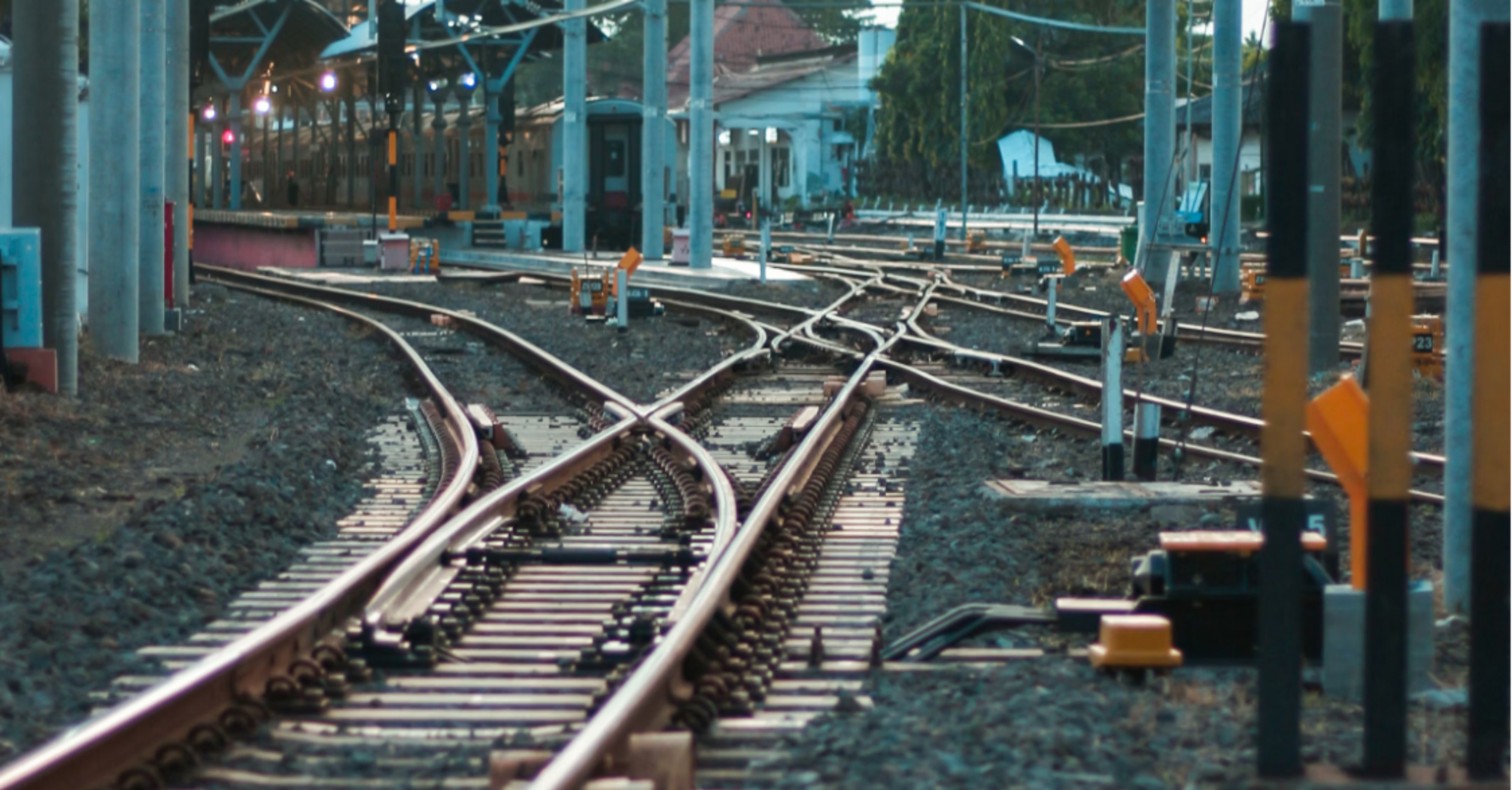 Railway tracks under maintenance with overhead electric lines