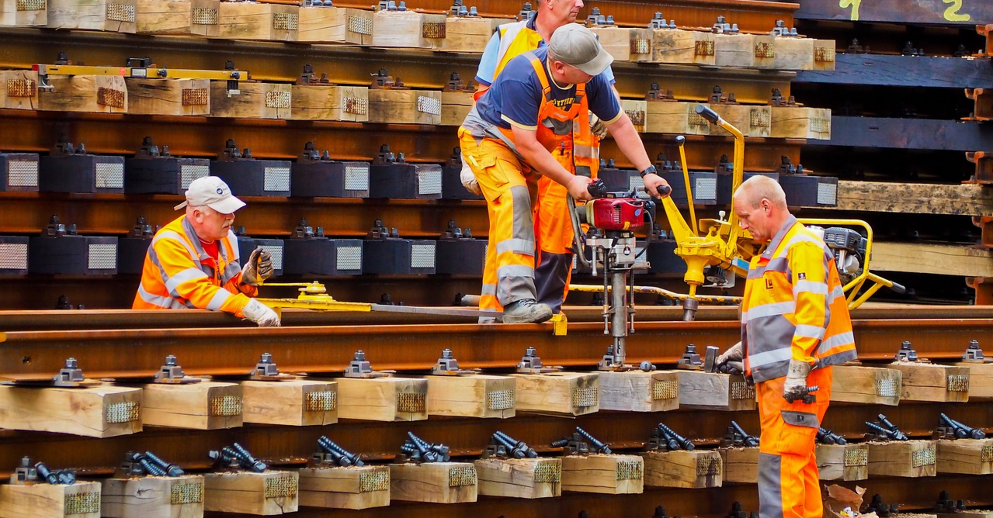 Workers repairing railway tracks during maintenance