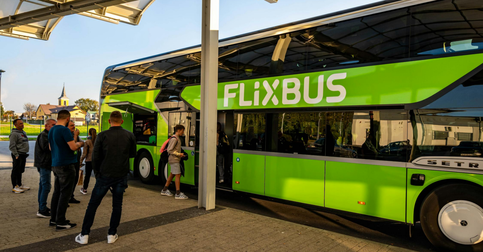 A FlixBus coach parked on a sunny street