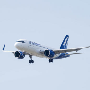 Aegean Airlines aircraft approaching for landing against a clear sky