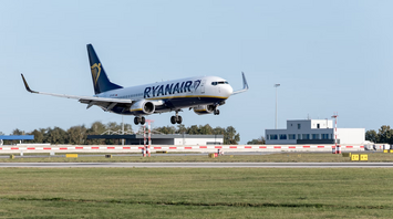 Ryanair aircraft landing at an airport runway