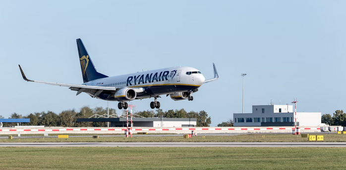 Ryanair aircraft landing at an airport runway