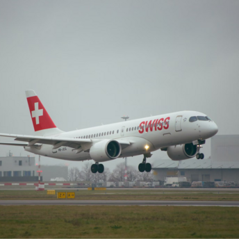 SWISS plane landing on runway in cloudy weather