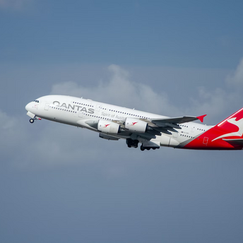 Qantas aircraft taking off into a clear sky