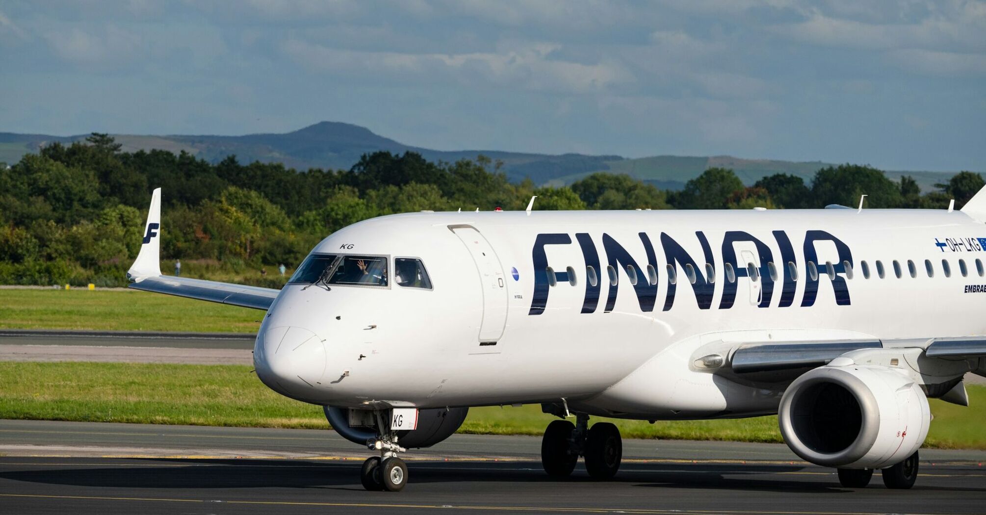 Finnair aircraft taxiing on a snowy runway in winter