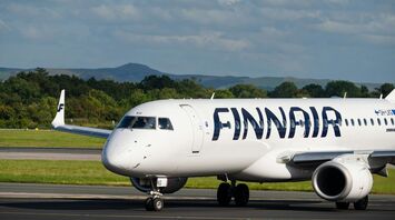 Finnair aircraft taxiing on a snowy runway in winter