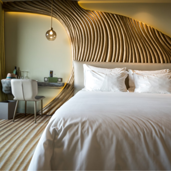 Stylish modern hotel room with sculpted wood paneling and white bedding