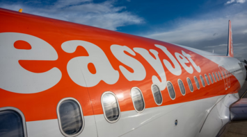 Side view of an easyJet airplane on the runway