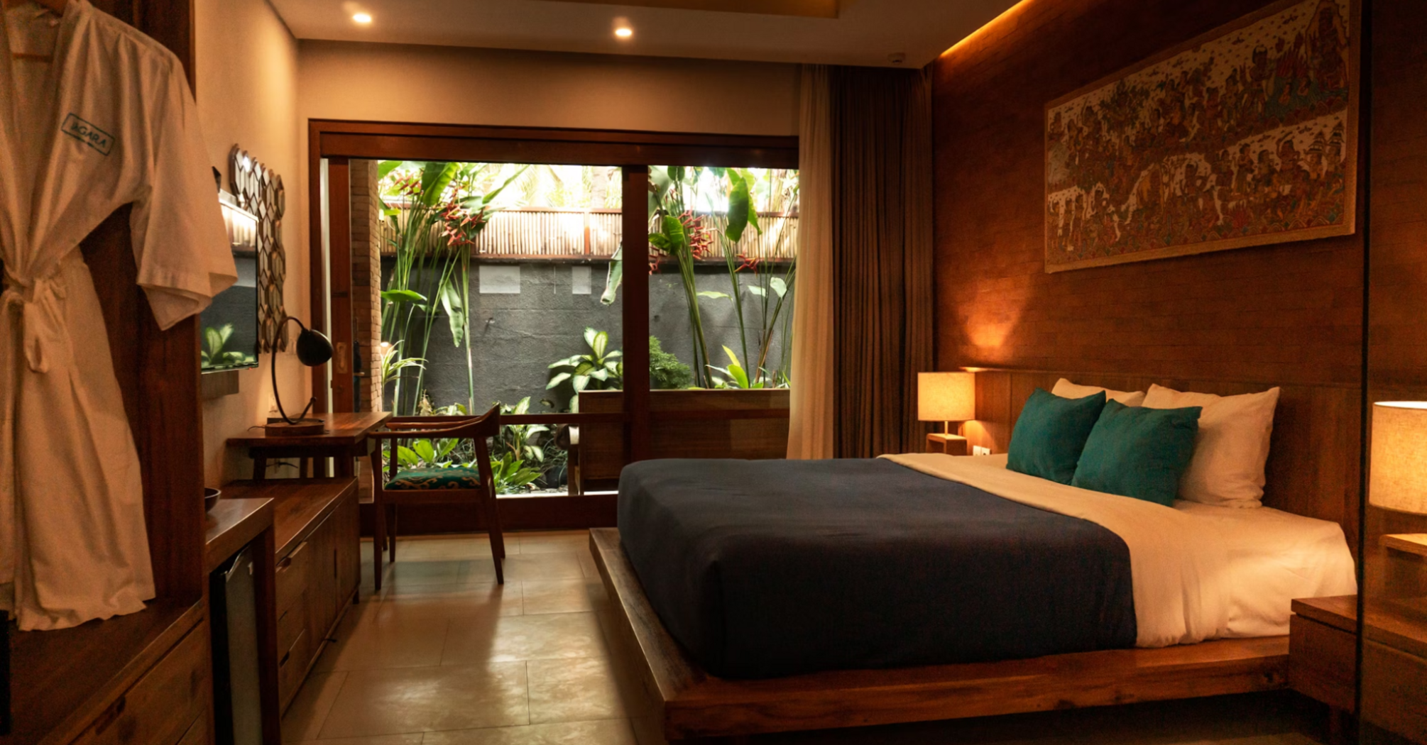 Modern hotel room with wooden decor and garden view