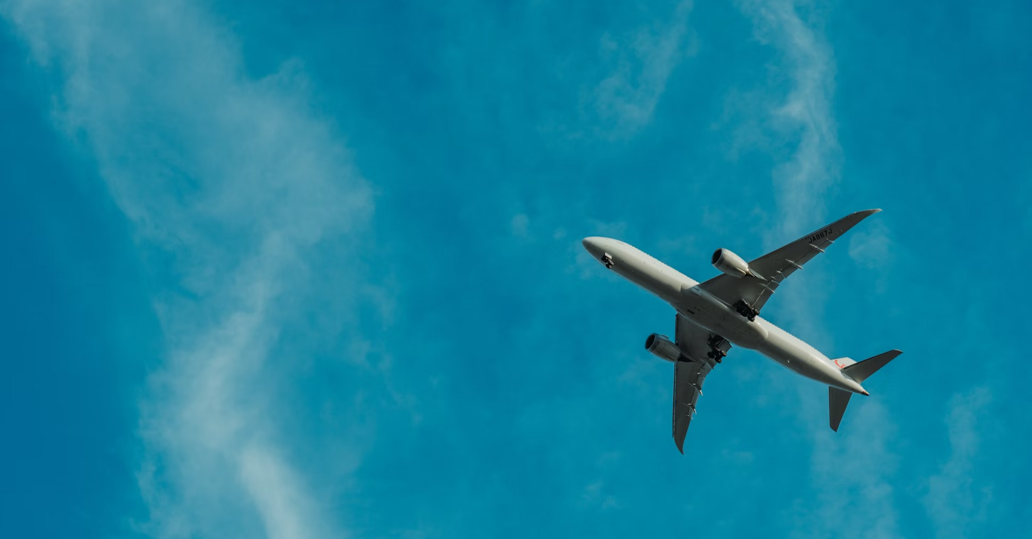 Passenger airplane flying against a clear blue sky