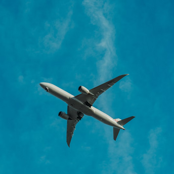 Passenger airplane flying against a clear blue sky