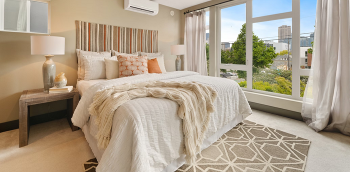 Modern hotel room with large windows and city view