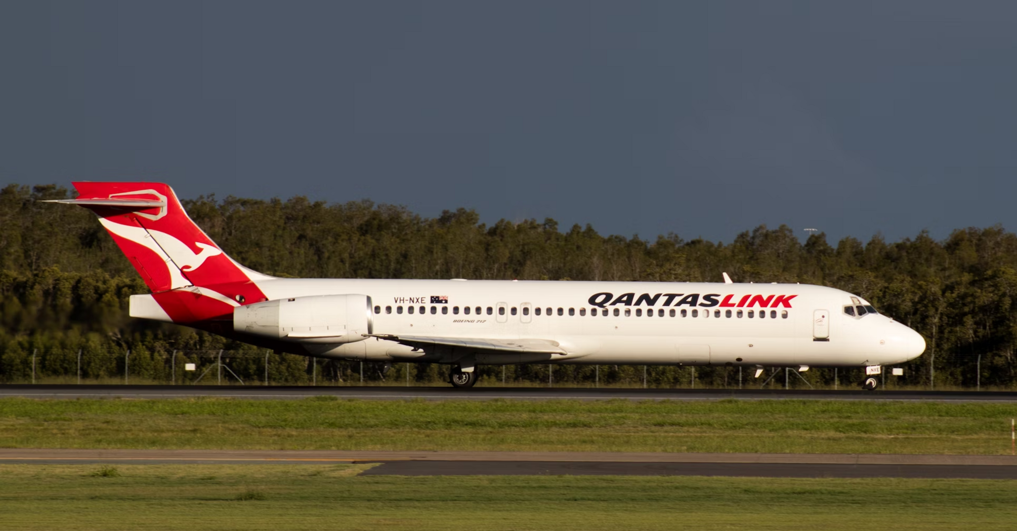 QantasLink aircraft taxiing on runway