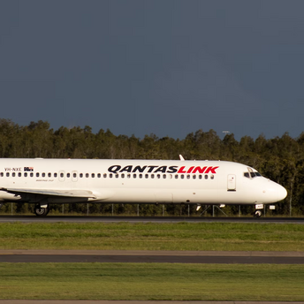QantasLink aircraft taxiing on runway