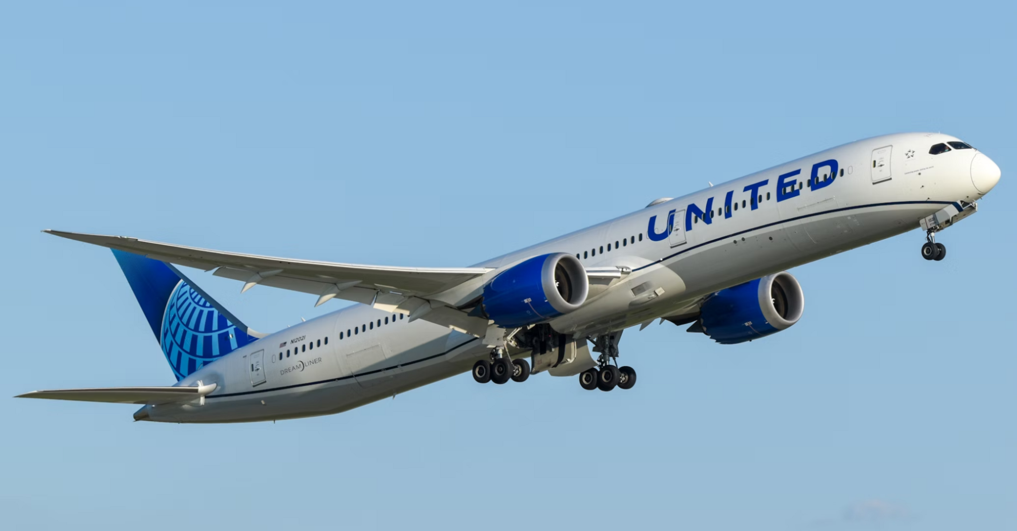 United Airlines plane taking off into clear sky