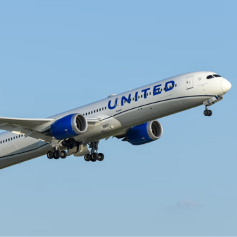 United Airlines plane taking off into clear sky