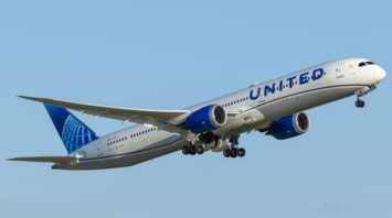 United Airlines plane taking off into clear sky