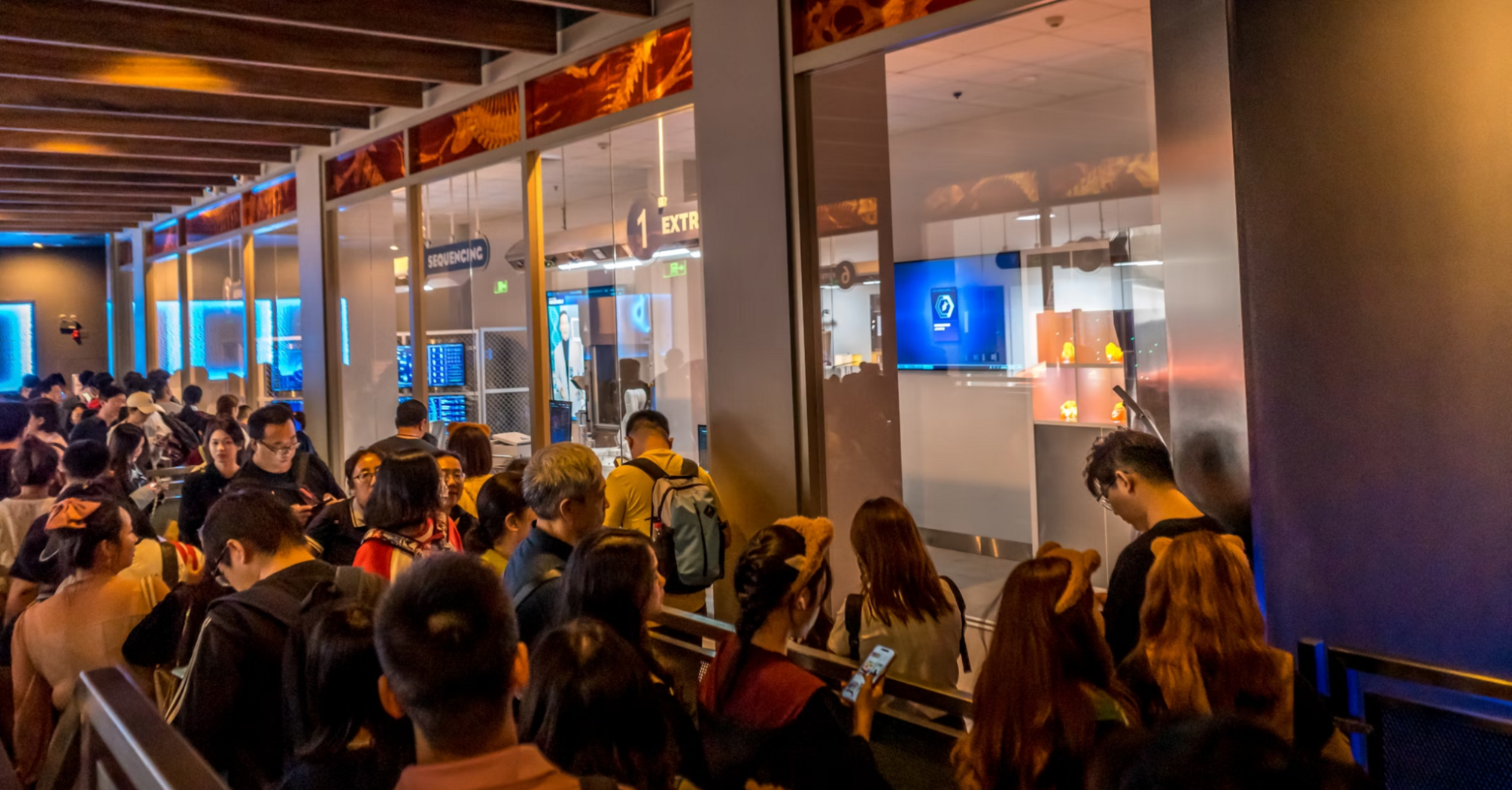 Crowds of travelers waiting in a long airport queue