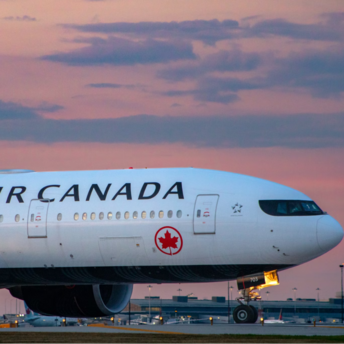 Air Canada aircraft on runway during sunset