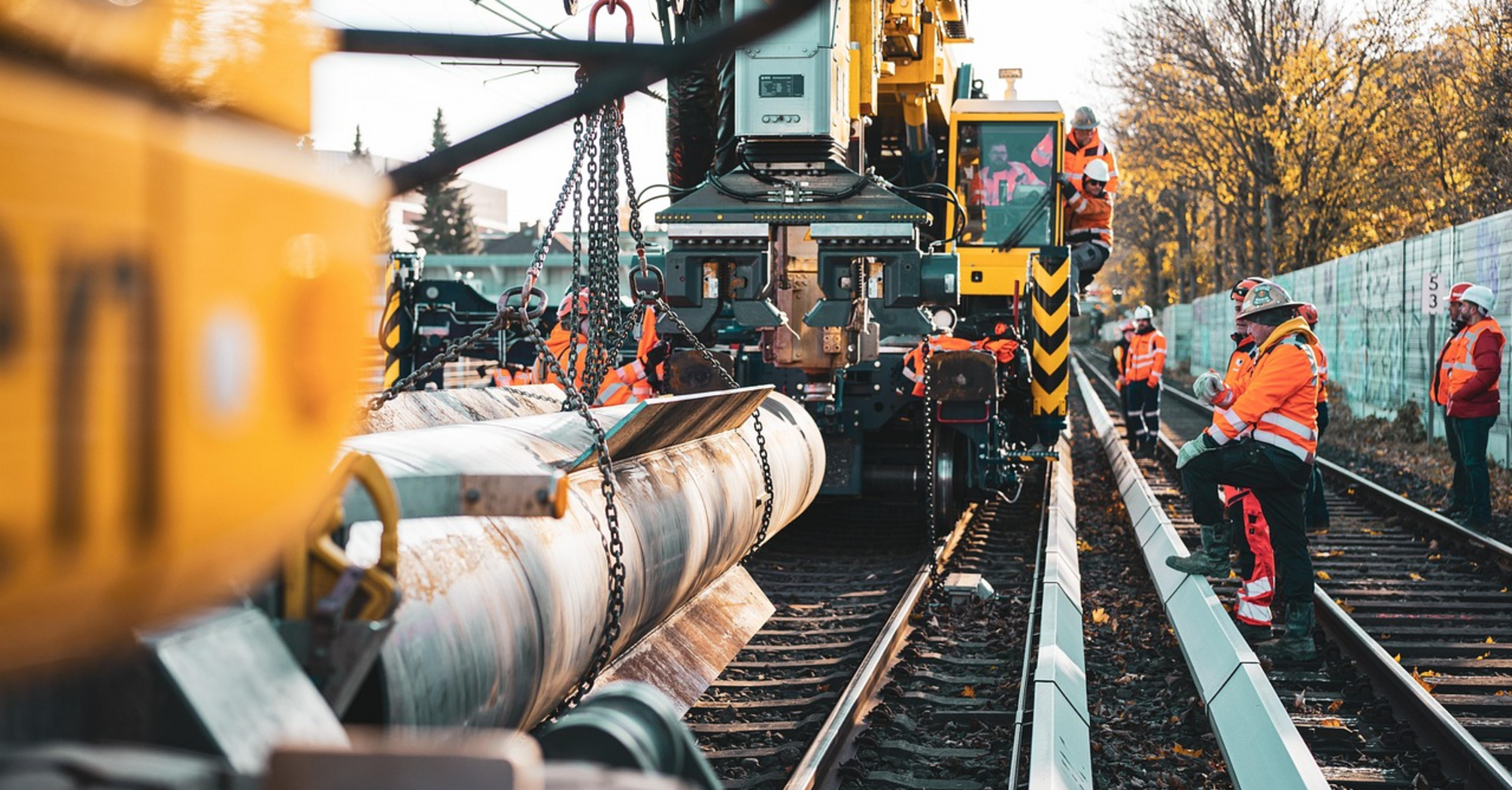 Railway track maintenance with a crane and equipment at the site