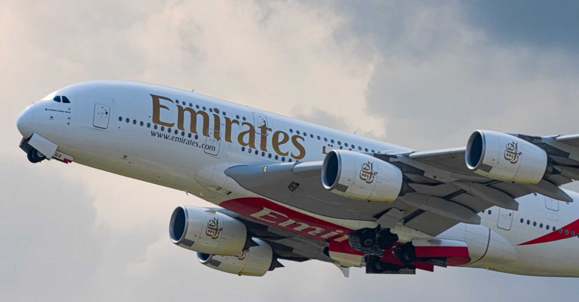 Emirates Airbus A380 taking off into cloudy sky