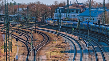 Railway tracks with train and wires