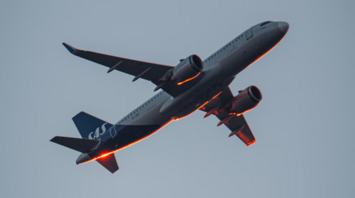 Commercial airplane in flight against a clear sky