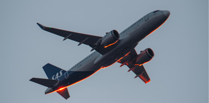 Commercial airplane in flight against a clear sky