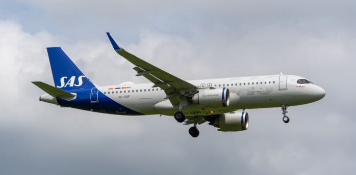 SAS aircraft preparing to land under cloudy sky