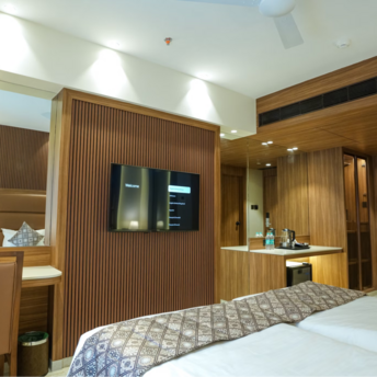 Modern guest room interior at Avani+ Barbarons with wood accents and workspace