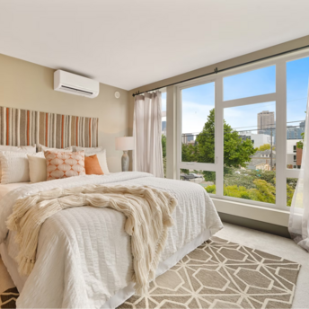 Modern hotel room with large windows and city view