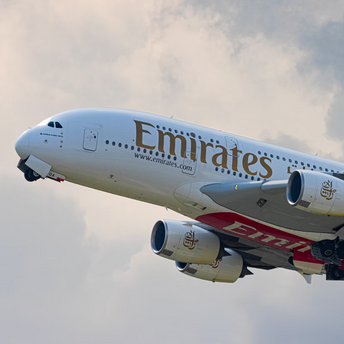 Emirates Airbus A380 taking off into cloudy sky