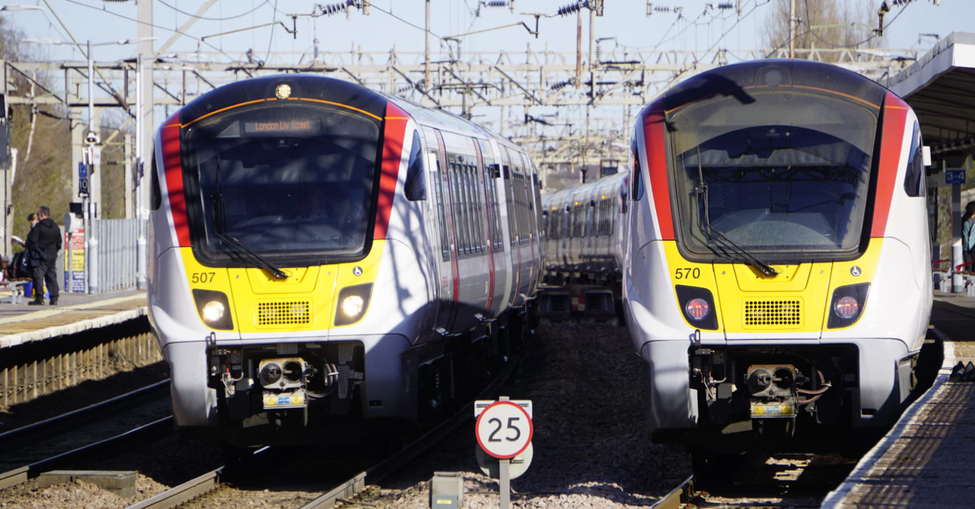 Greater Anglia trains at a station platform in London