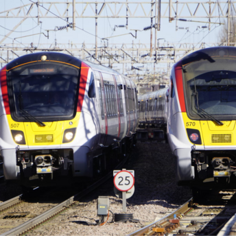 Greater Anglia trains at a station platform in London