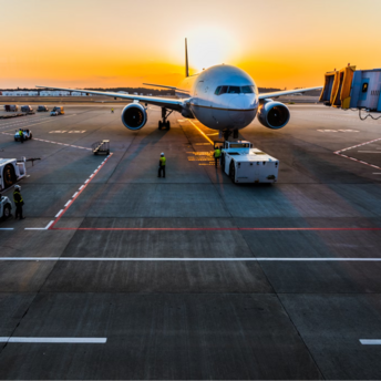 Passenger aircraft being prepared for early morning departure at airport gate