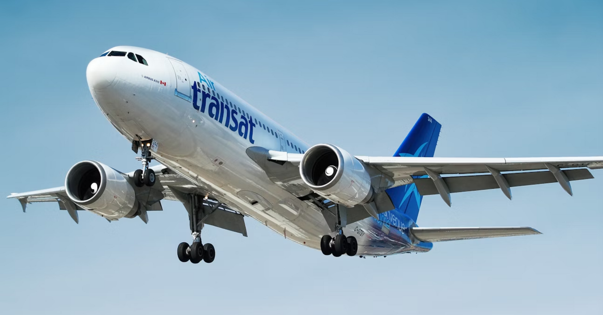 Air Transat aircraft approaching for landing under clear skies