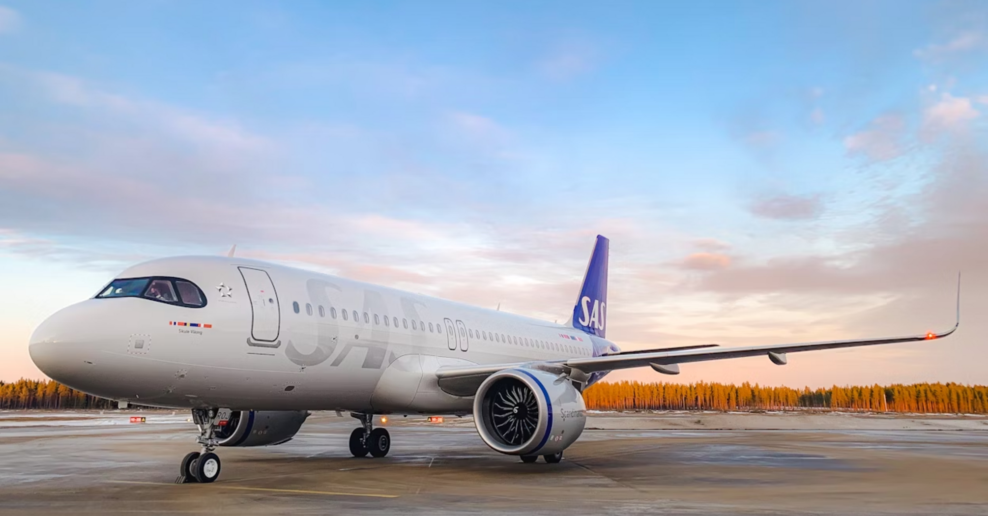 SAS aircraft parked at sunset ahead of SkyTeam system updates