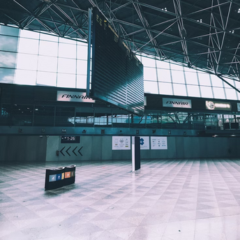 Empty departure board at Helsinki Airport terminal during operational disruption
