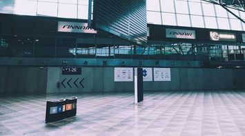 Empty departure board at Helsinki Airport terminal during operational disruption